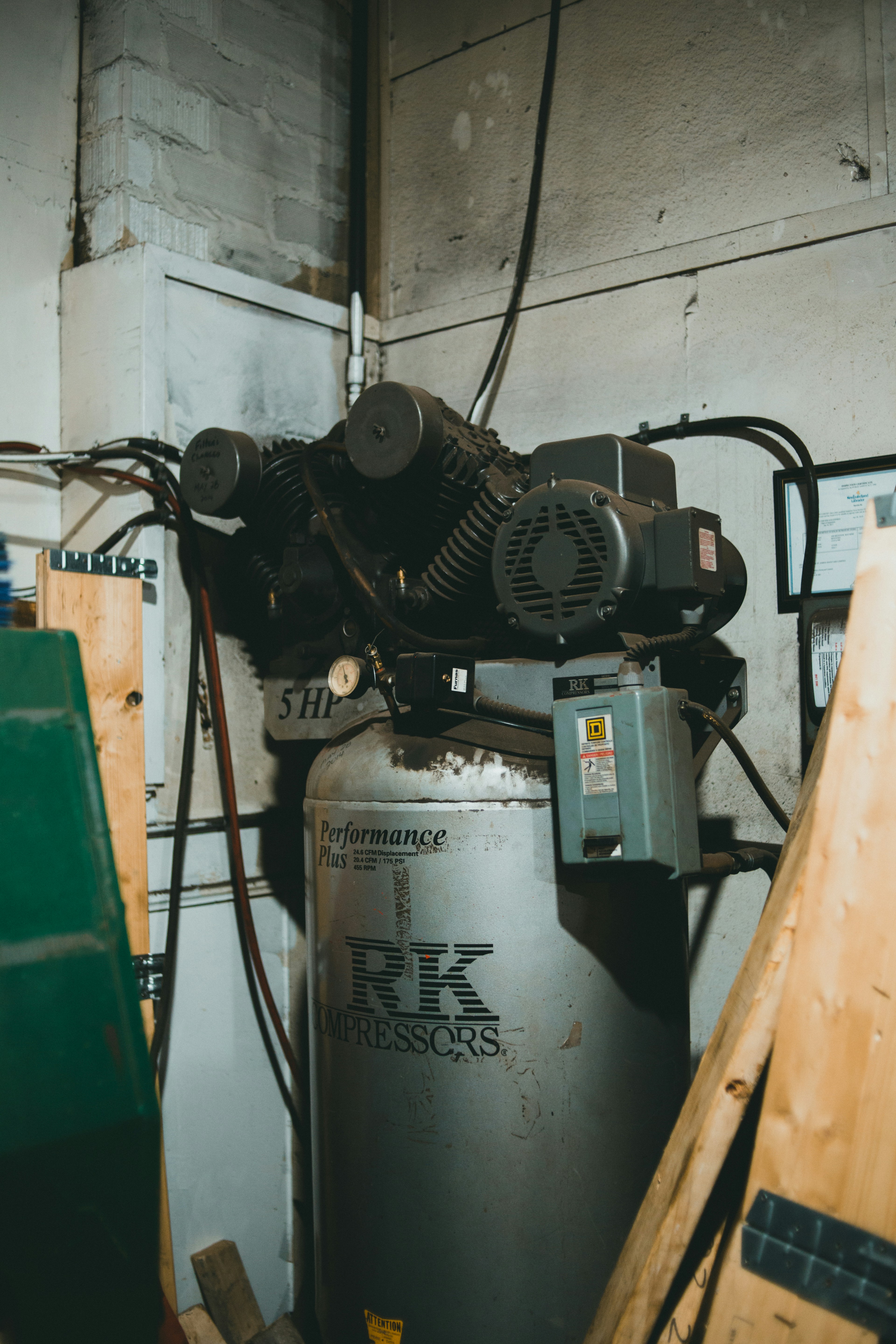 a propane tank in a garage next to a wall