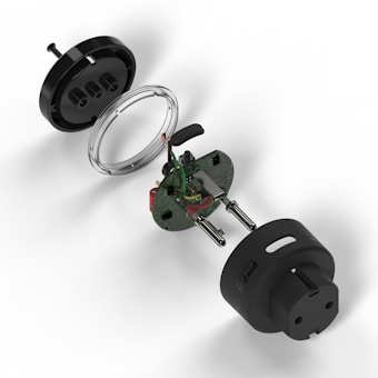 An exploded view of an electrical plug showing internal components including a black outer casing, a circuit board with wires and metallic prongs. The various parts are separated to display intricate details of the assembly.