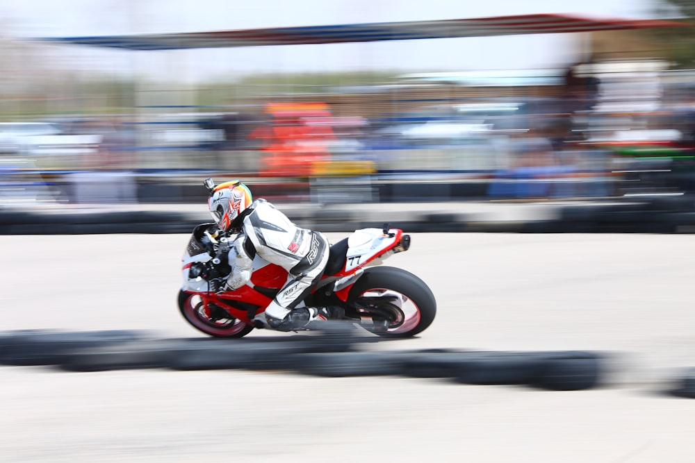 a person riding a motorcycle on a race track