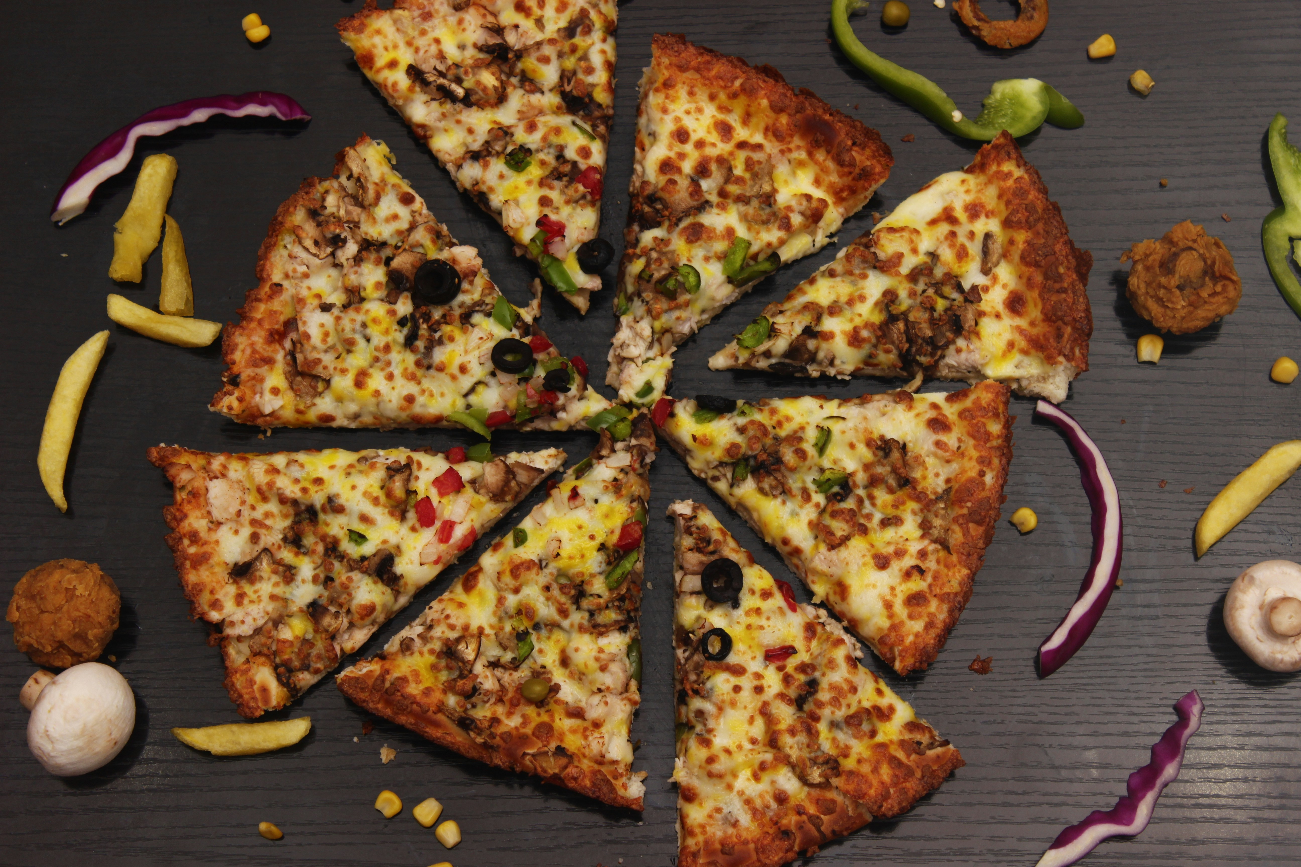 a pizza cut into eight slices on top of a table