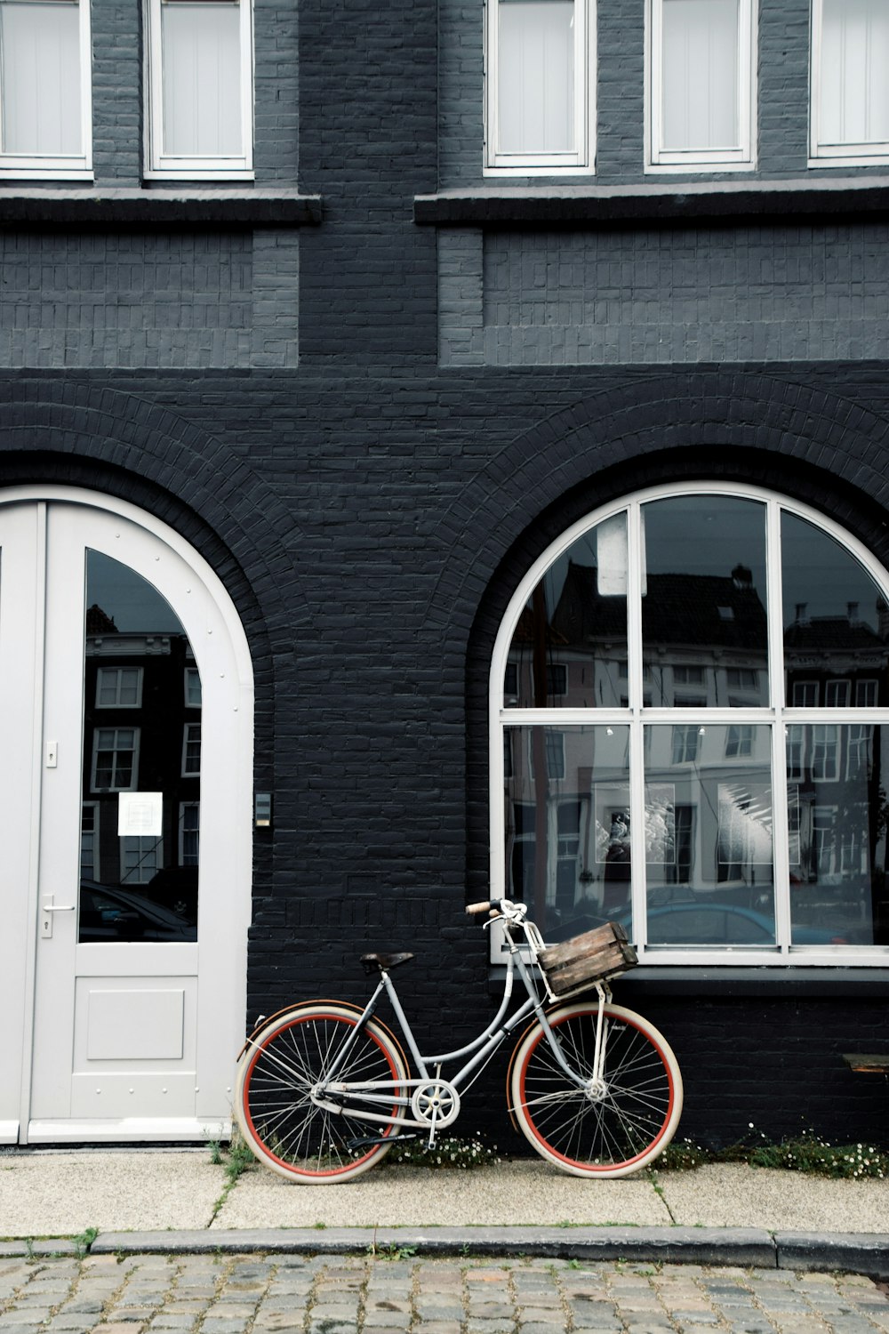 a bicycle parked in front of a building