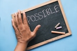 a chalkboard with the word possible written on it