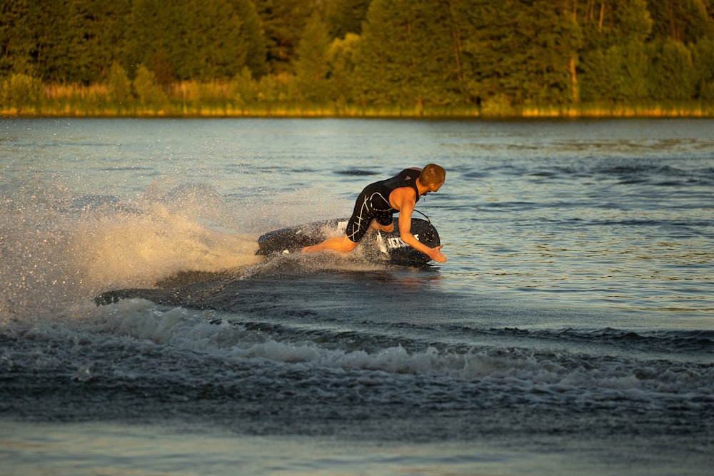 a man riding a wave on top of a surfboard