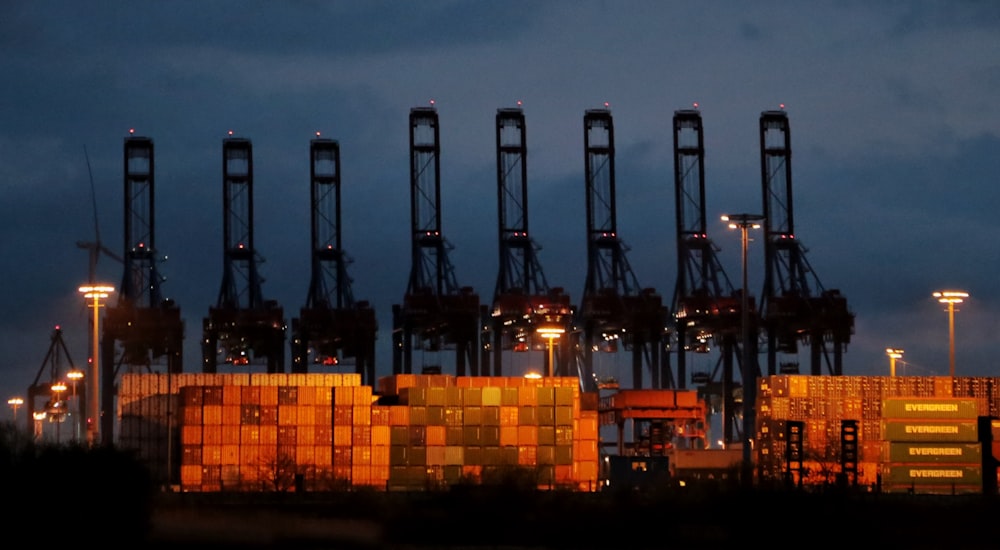 a large container ship in a harbor at night