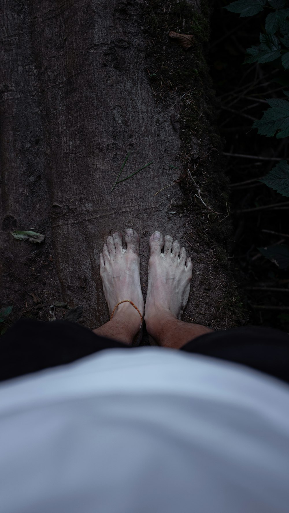 a person's bare feet and bare toe on the ground