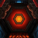 a red and yellow hexagonal structure with lights