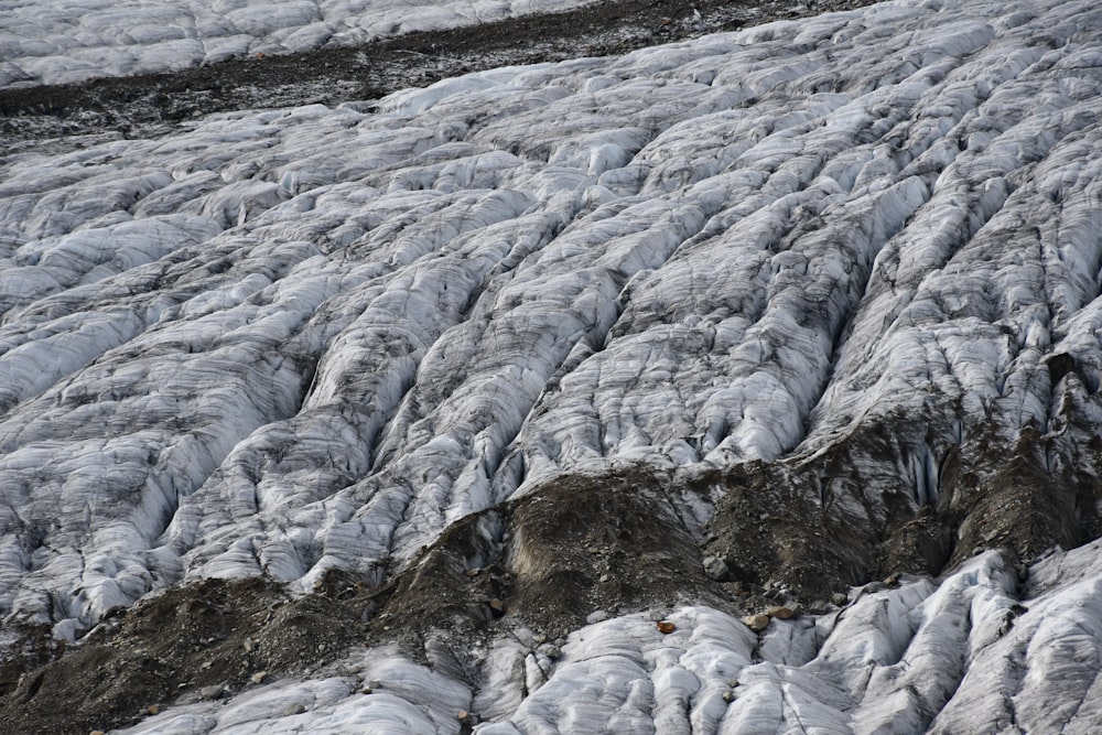 a man is skiing down a mountain covered in snow