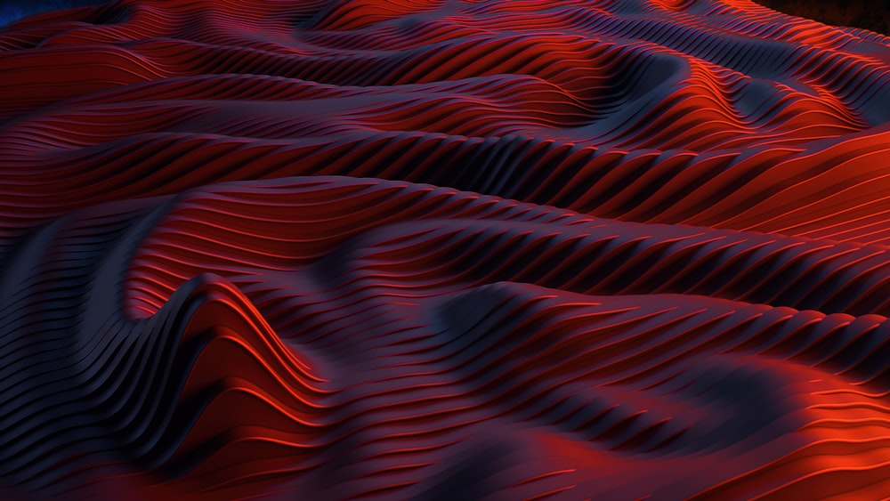 Ein abstraktes Bild von roten und blauen Wellen