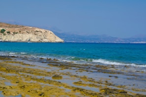 A picturesque beach with clear blue waters.