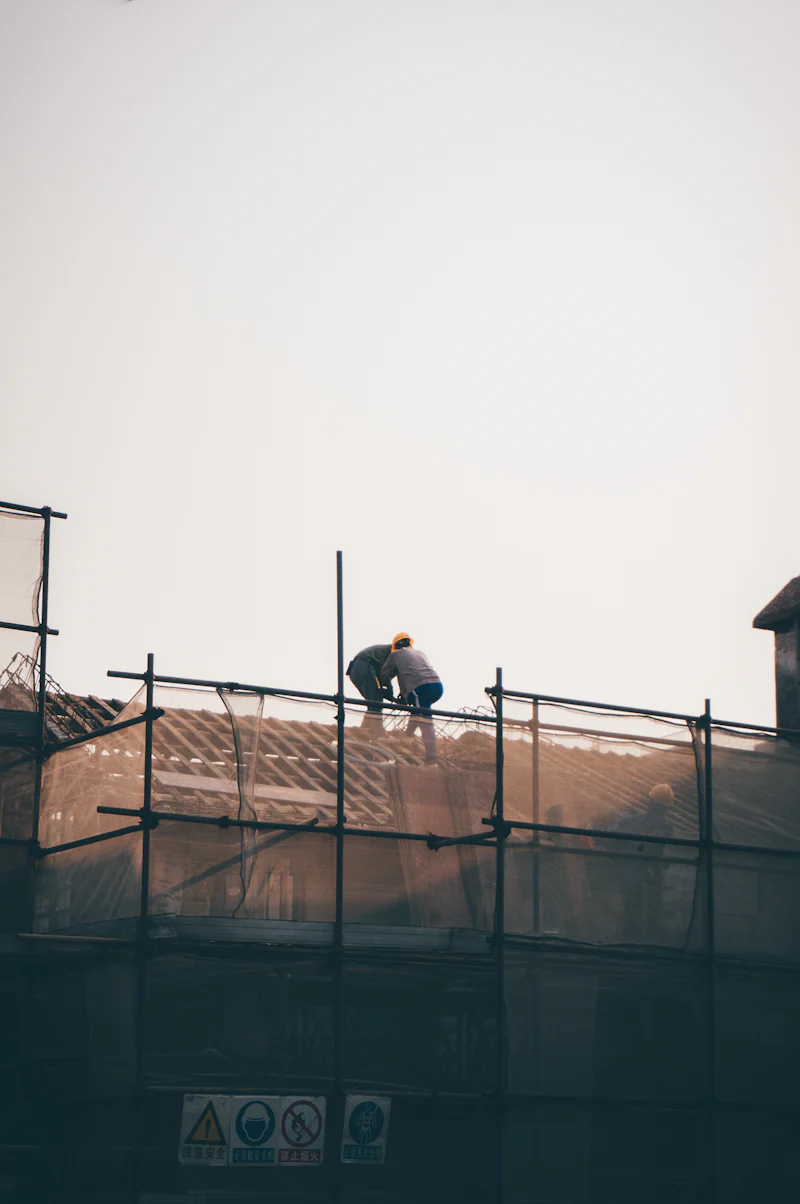 Contractor on scaffold