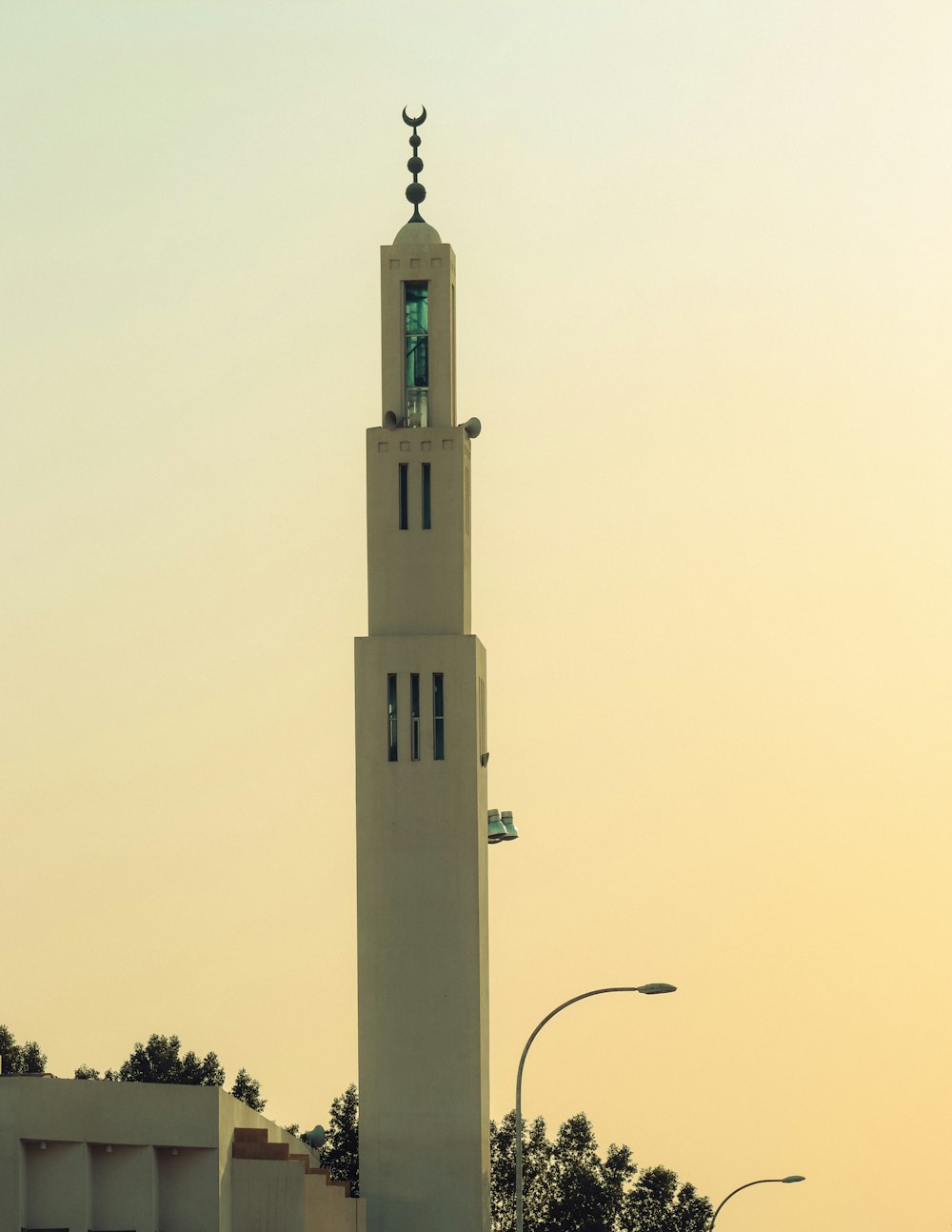 a tall white tower with a clock on top