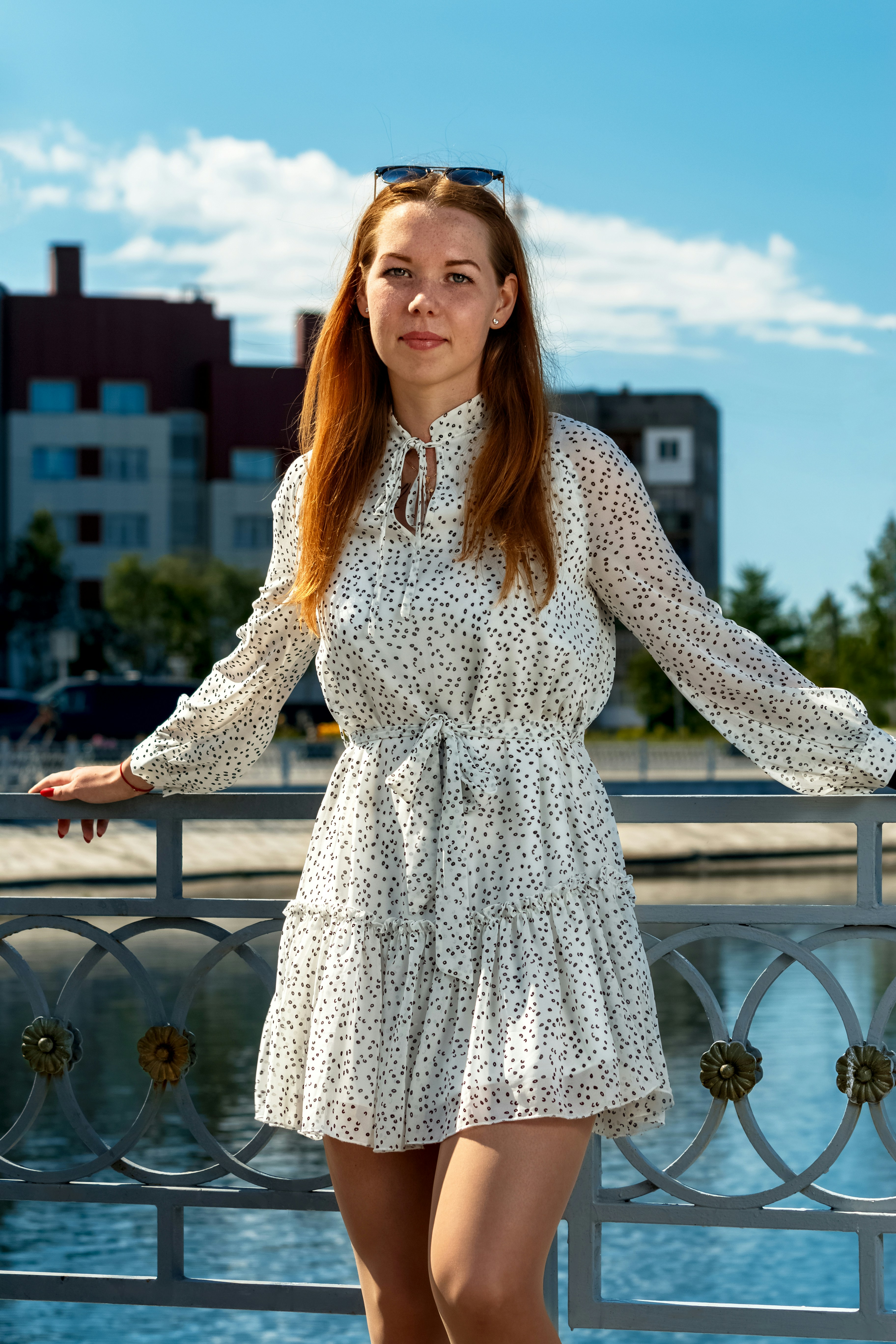 A woman in a white dress is posing for a picture photo – Free Sleeve ...