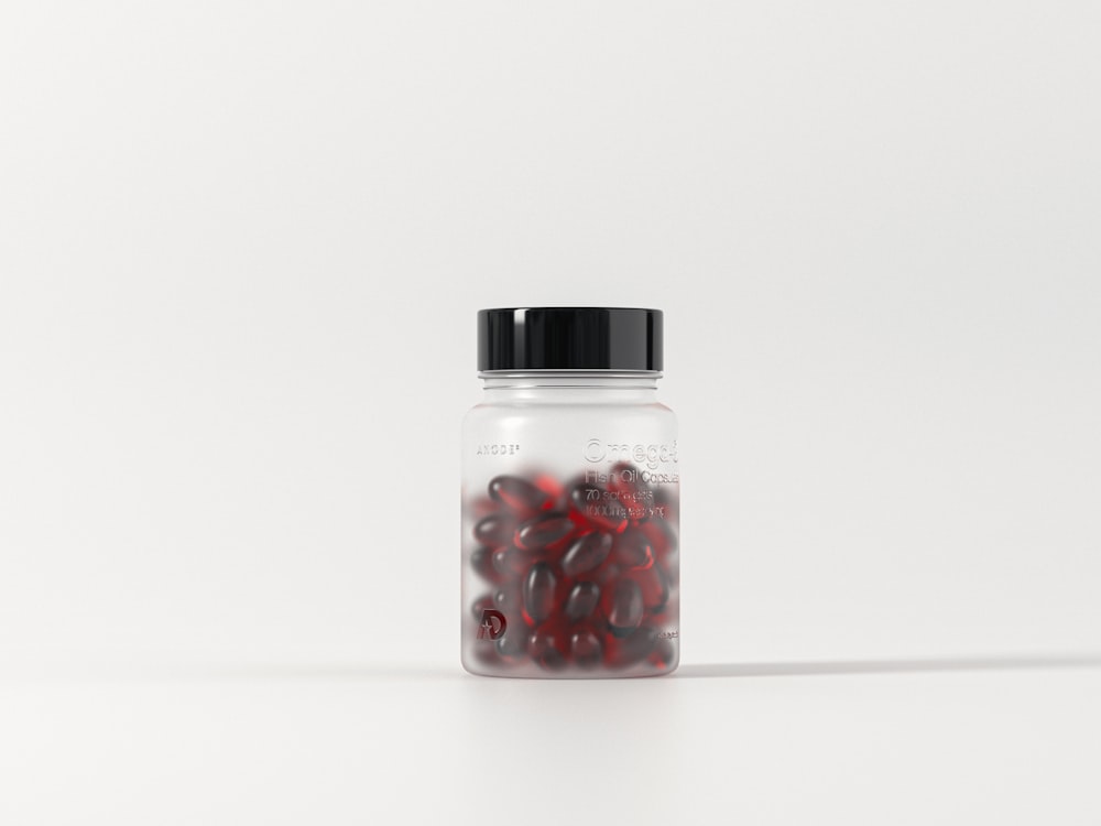 a glass jar filled with red and black beans