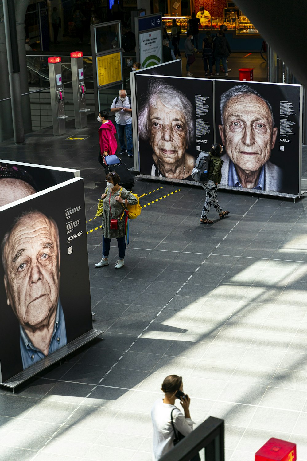 a group of people walking around a building