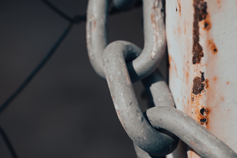 a close up of a chain attached to a wall