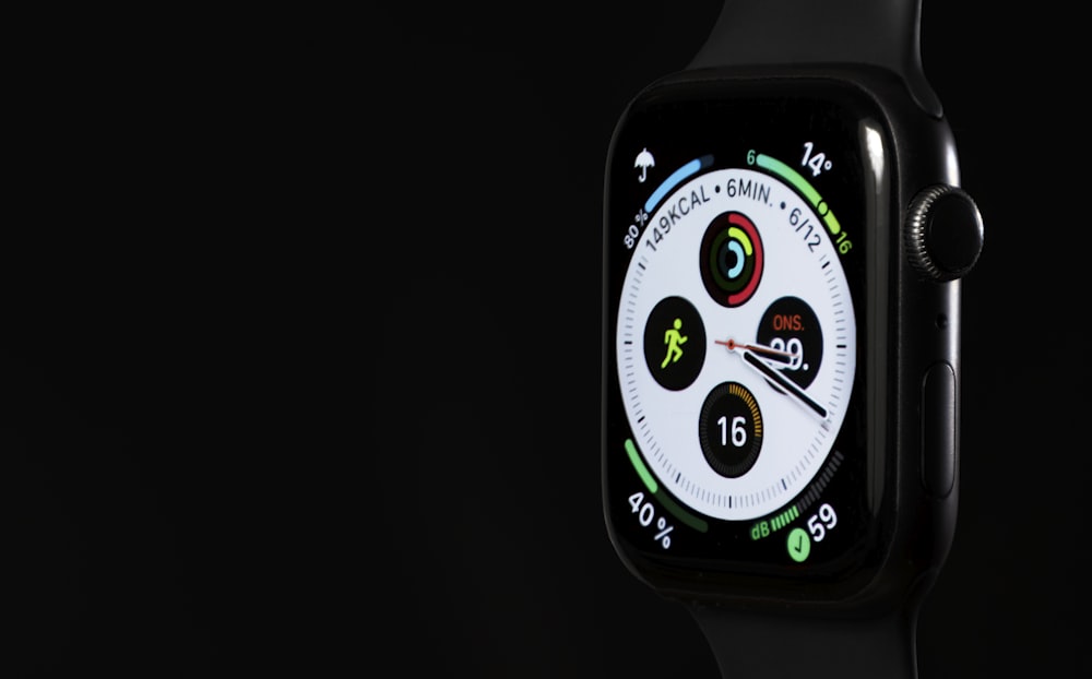 a close up of an apple watch on a black background