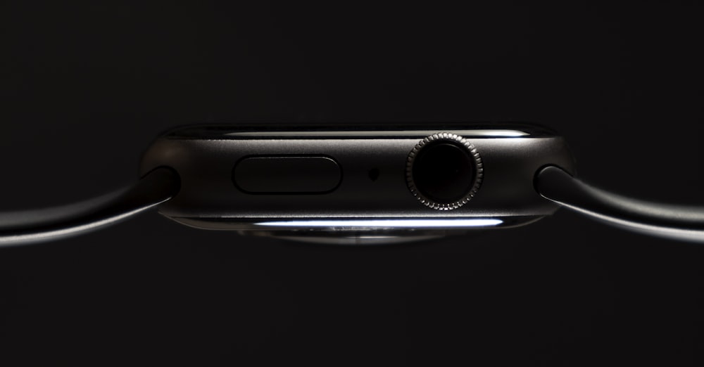 a close up of an apple watch on a black background