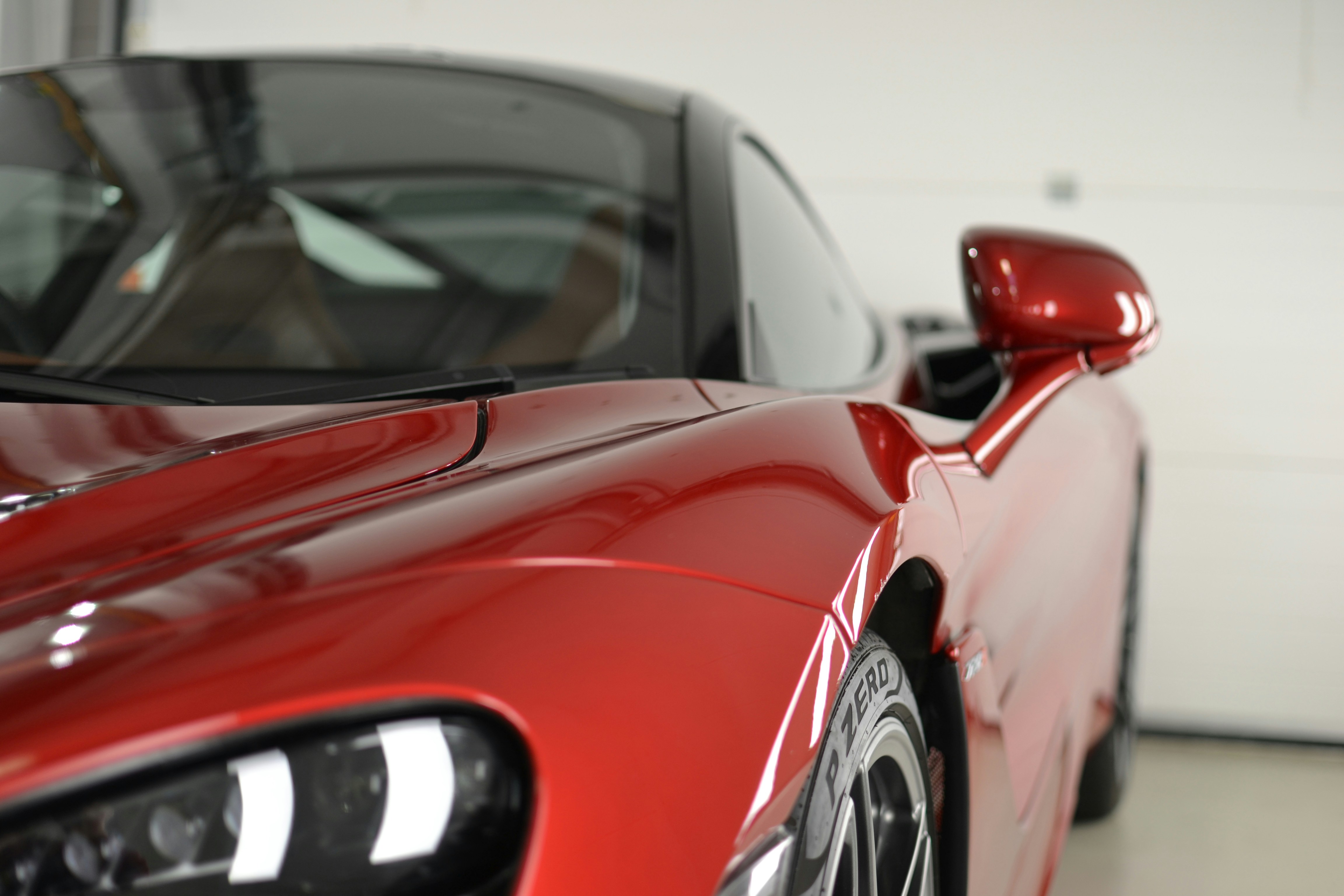 a red sports car parked in a garage