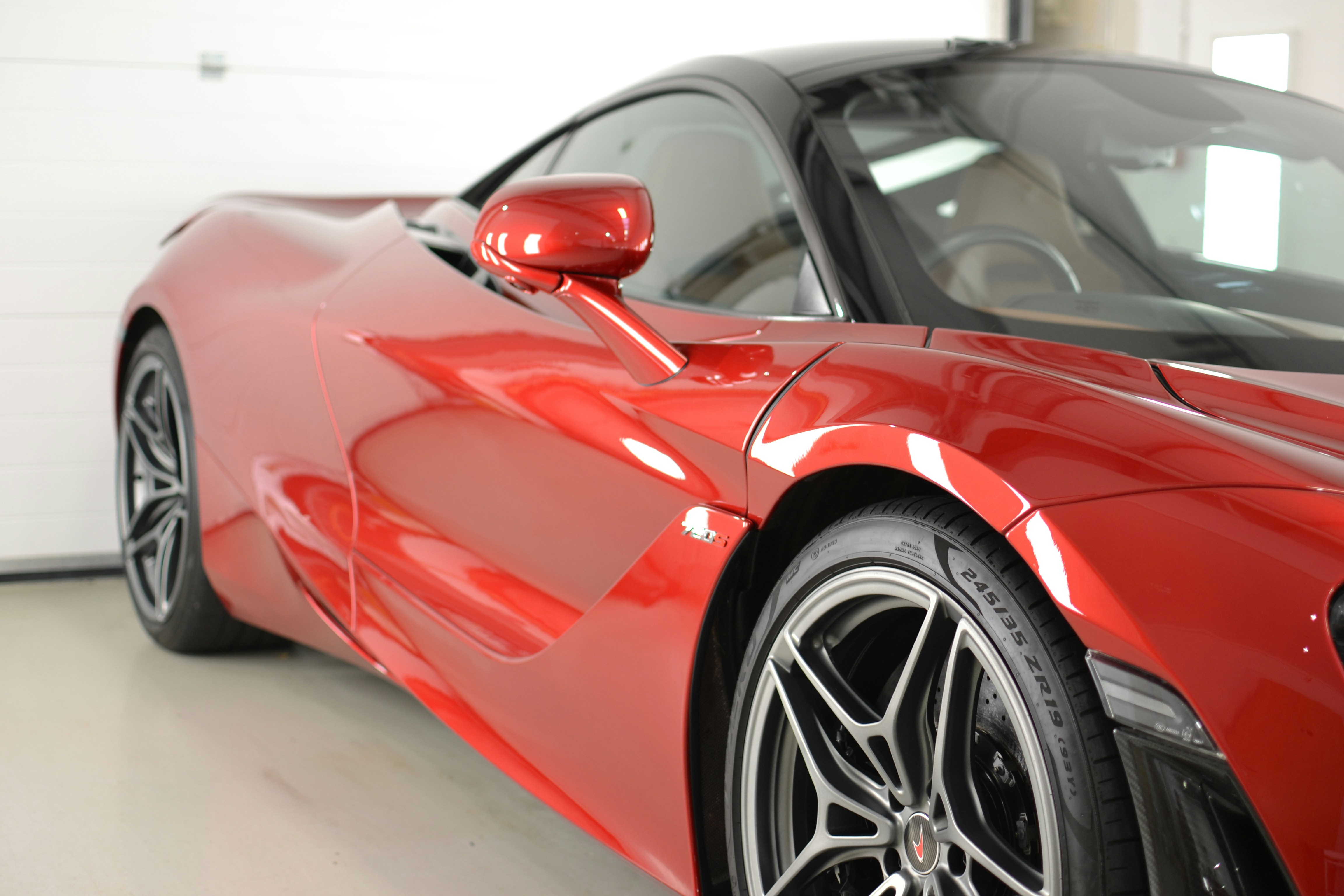 a red sports car parked in a garage