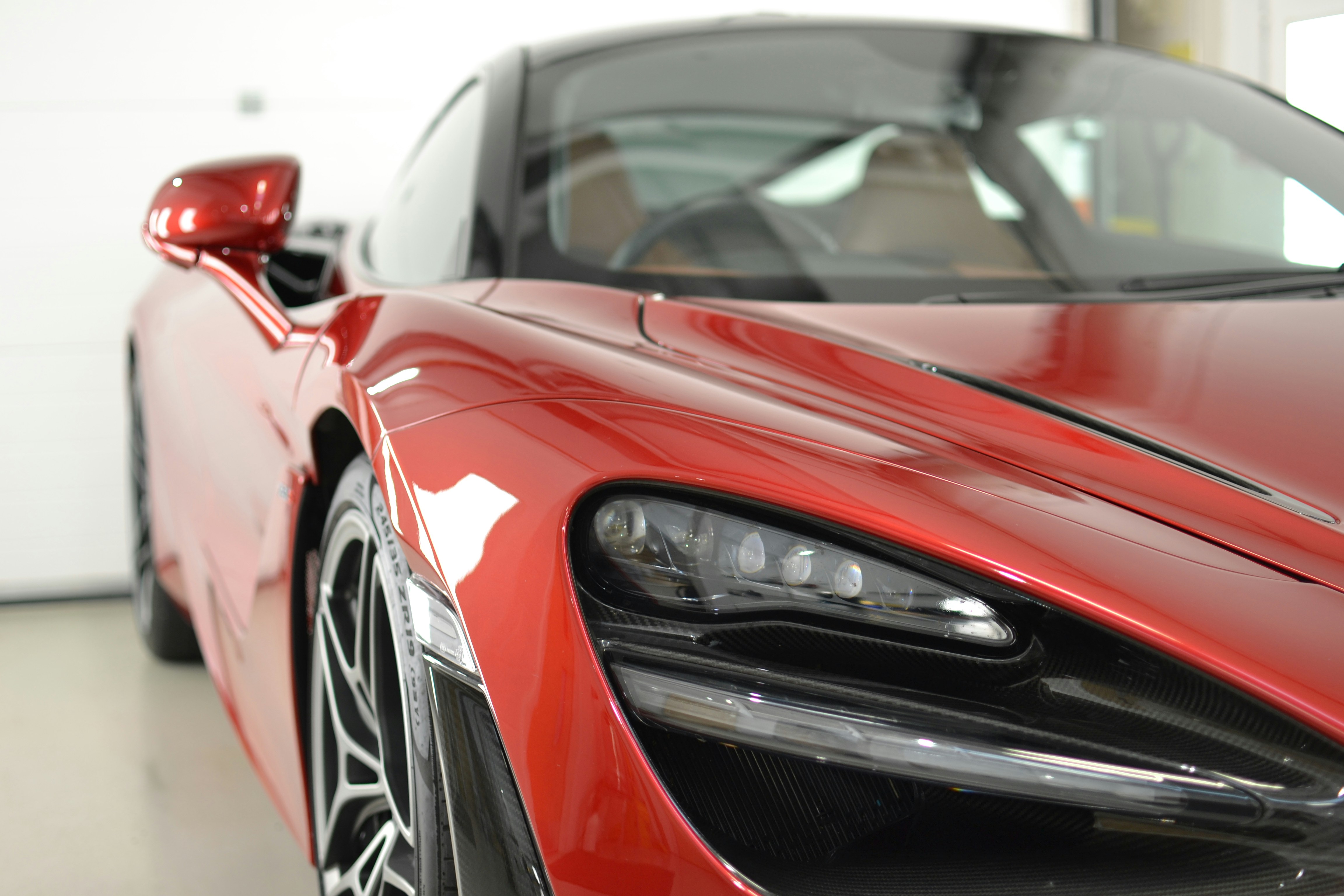 a red sports car parked in a garage