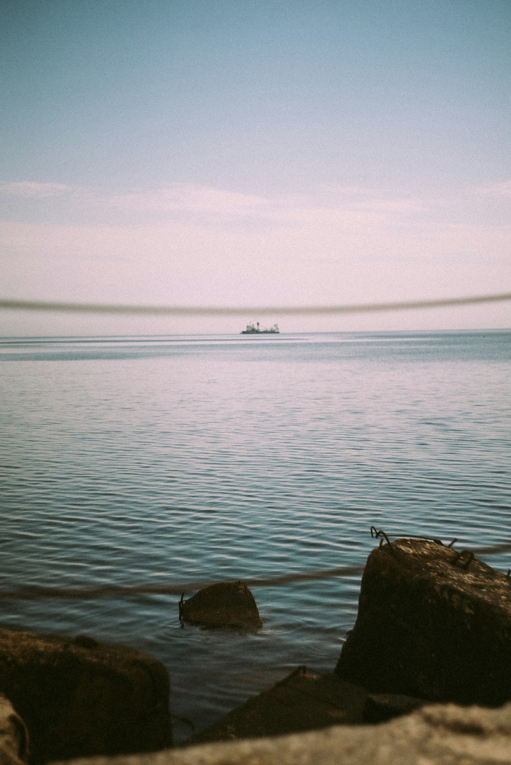 a body of water with a boat in the distance