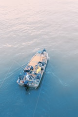 a small boat in the middle of the ocean
