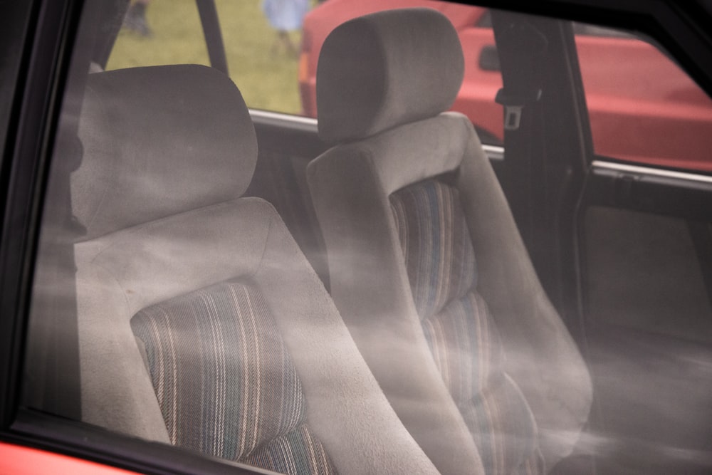 the interior of a car with the sun shining through the window