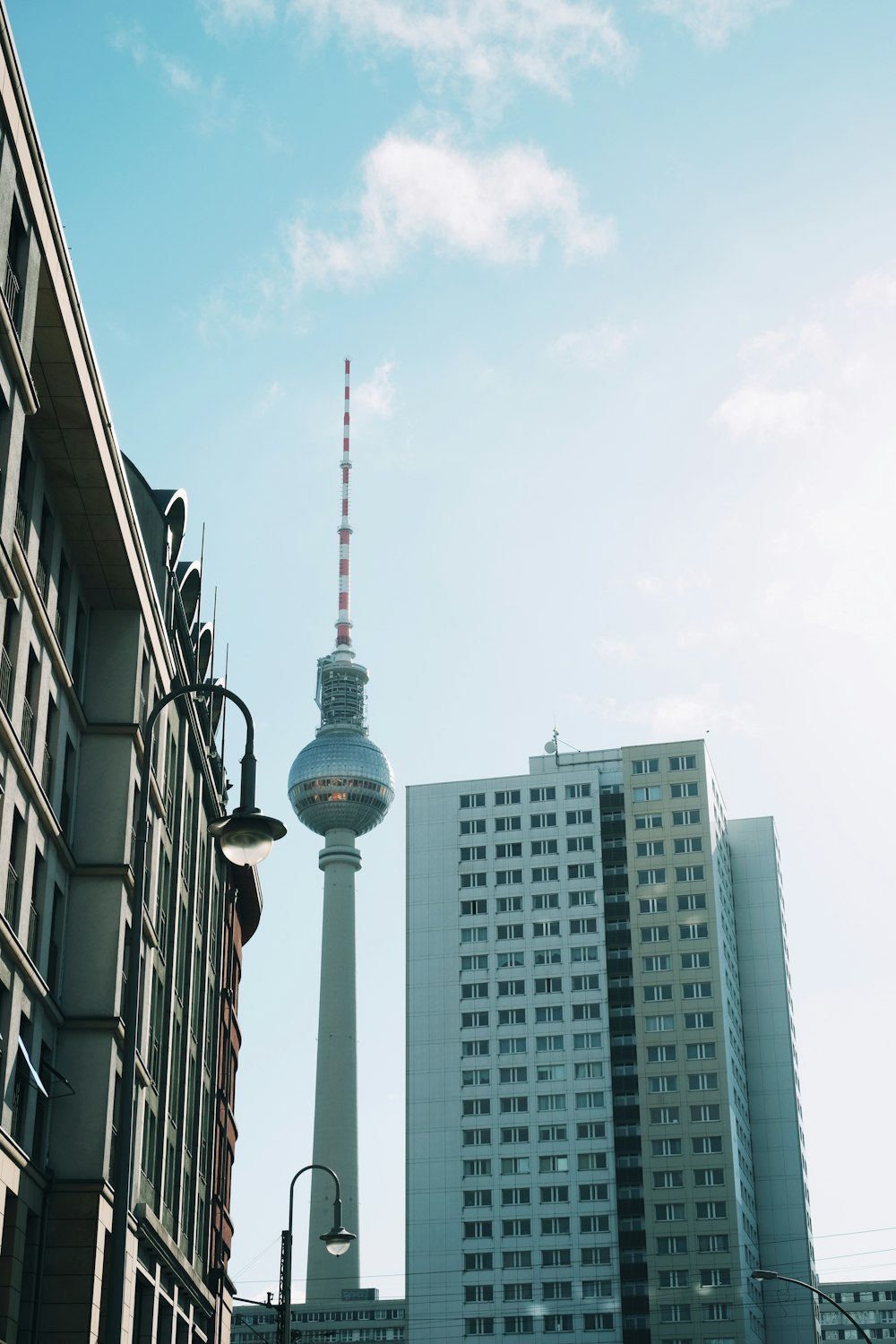 a tall building with a tv tower in the background