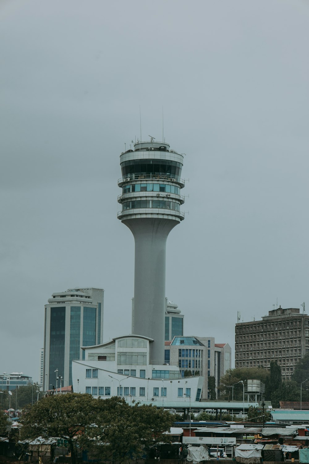 a very tall tower with a clock on it's side