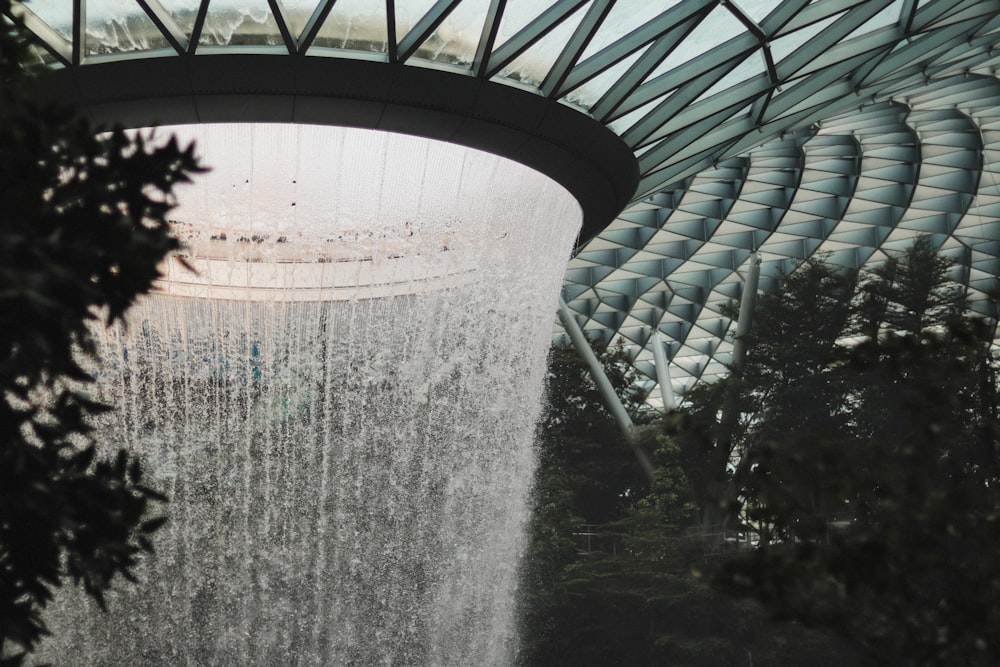 a large waterfall in the middle of a building