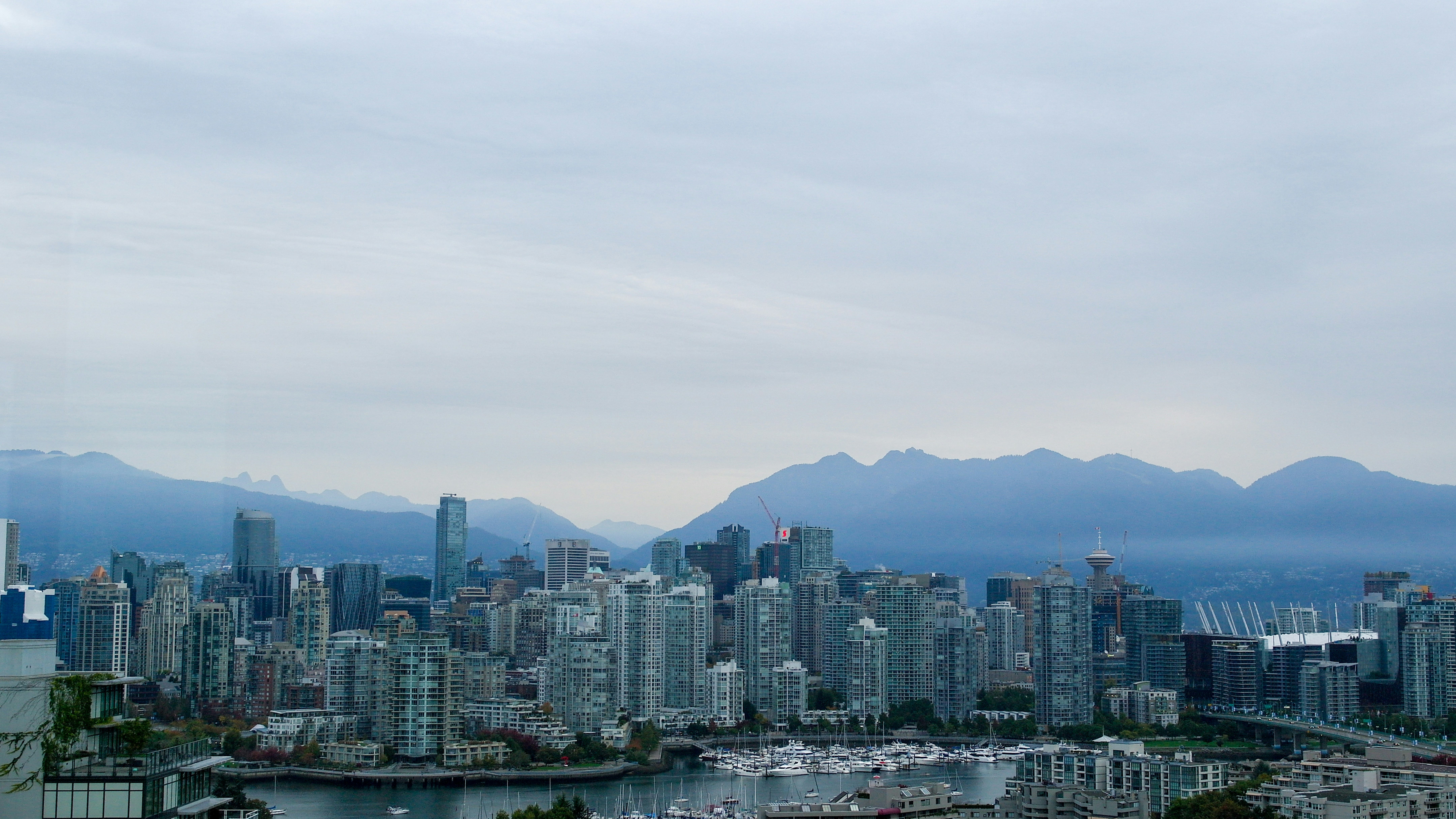 a view of a city with mountains in the background