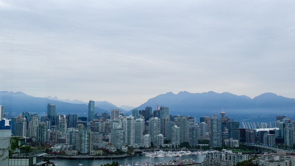 a view of a city with mountains in the background