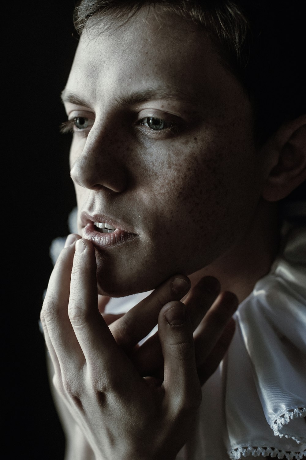 a man with freckled hair is posing for a picture