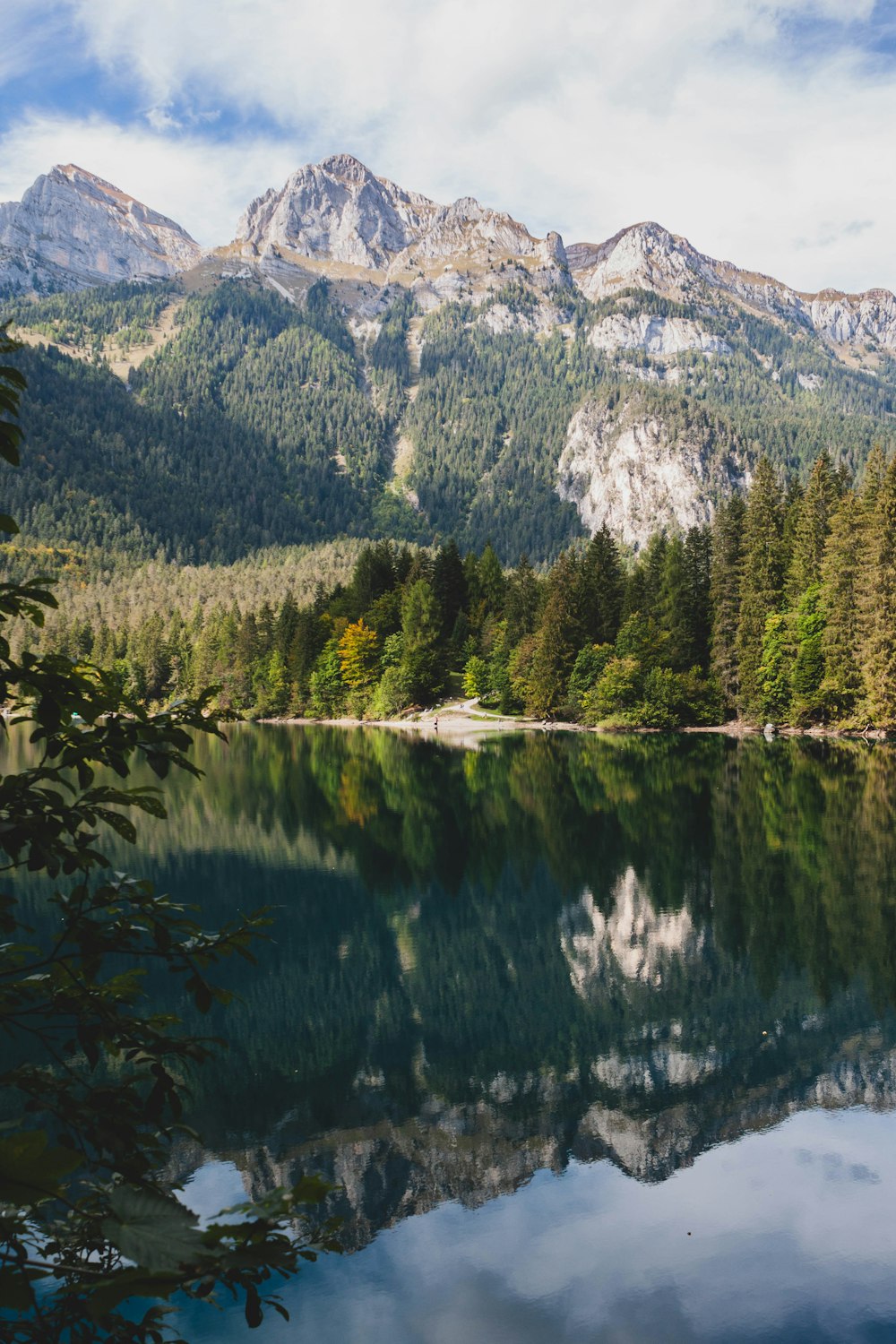 a lake surrounded by mountains and trees