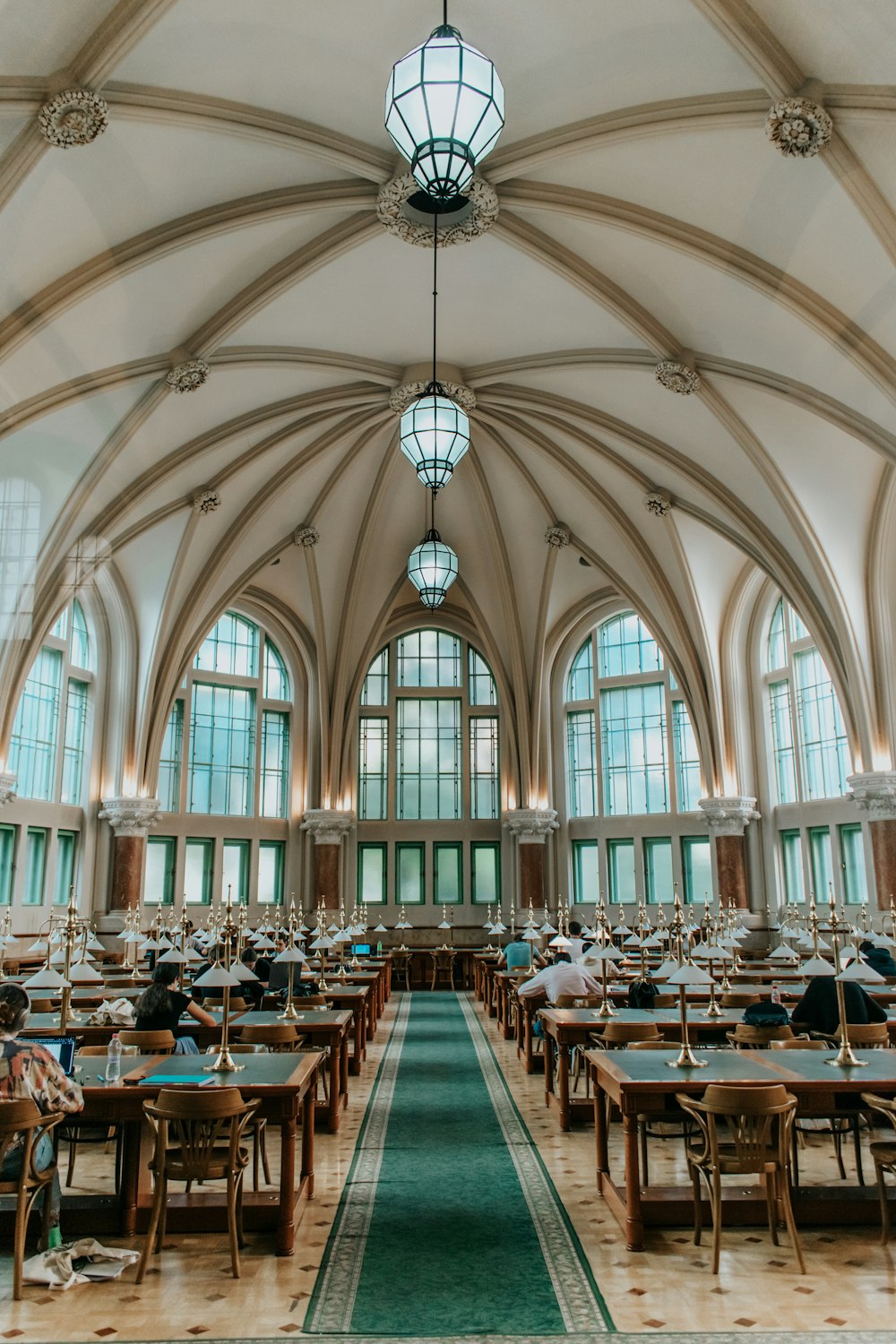 a large dining hall with tables and chairs