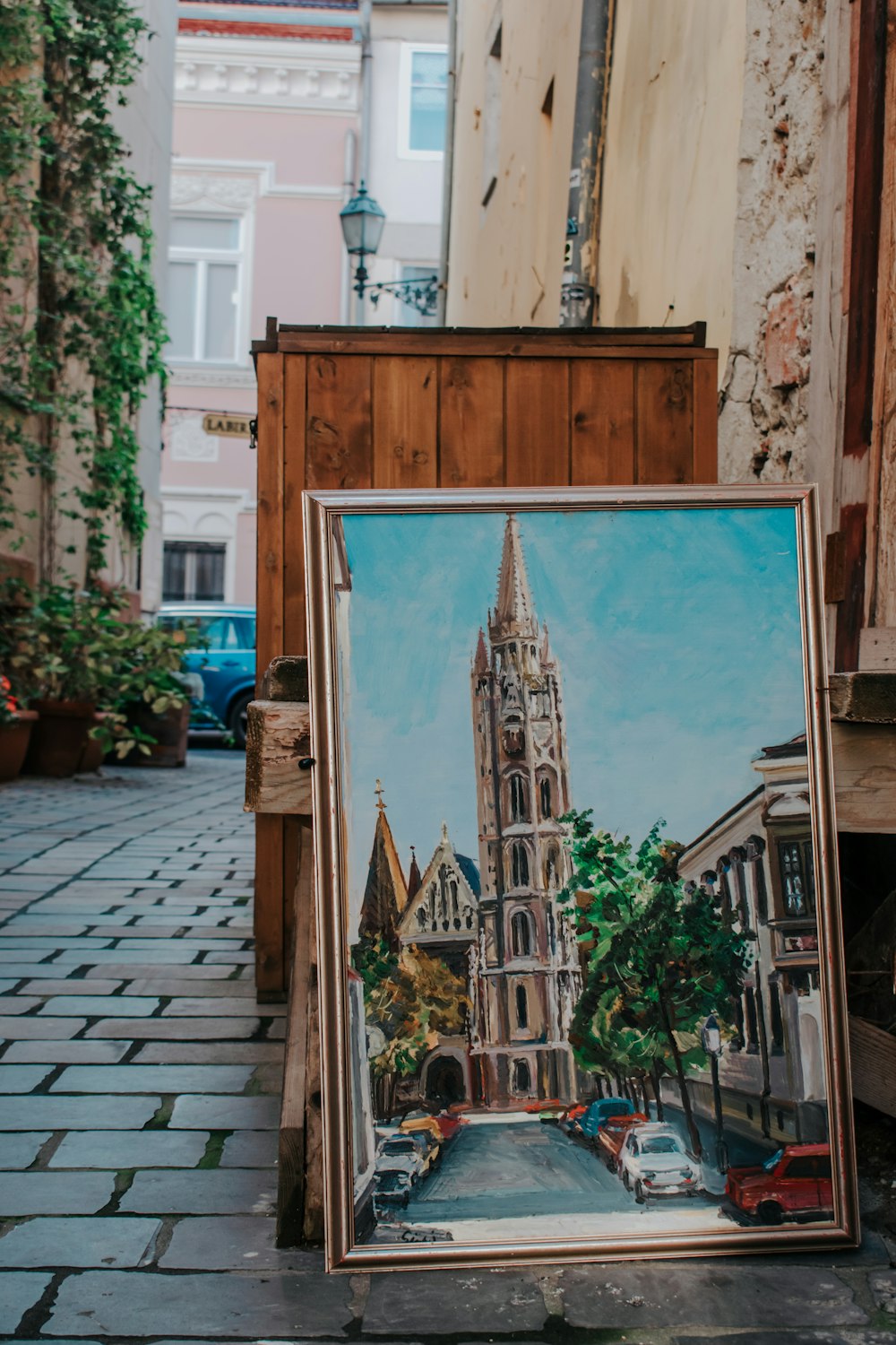 a painting of a church in a city