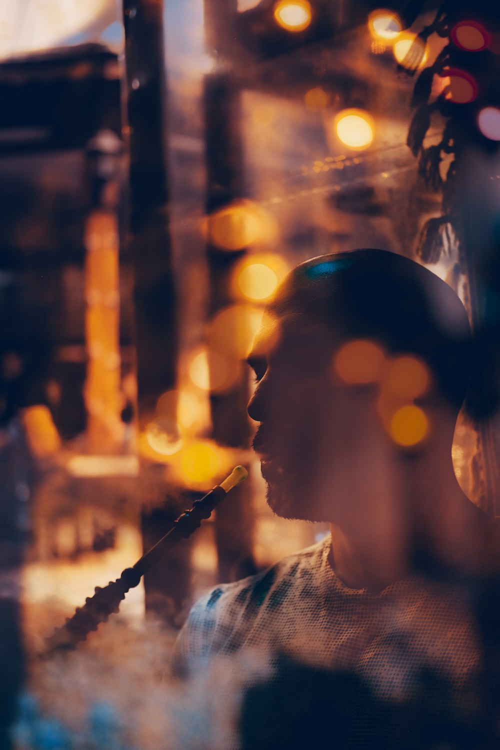 a man is looking through a window at a street