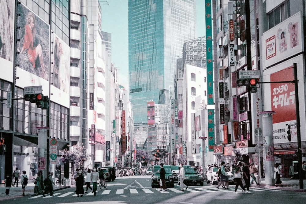 a city street filled with lots of tall buildings