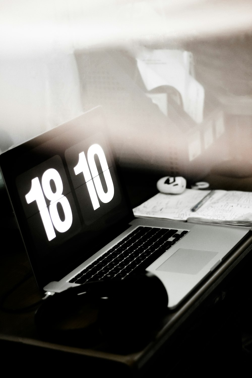 a laptop computer sitting on top of a desk