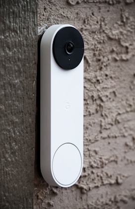 Modern video doorbell on a door frame