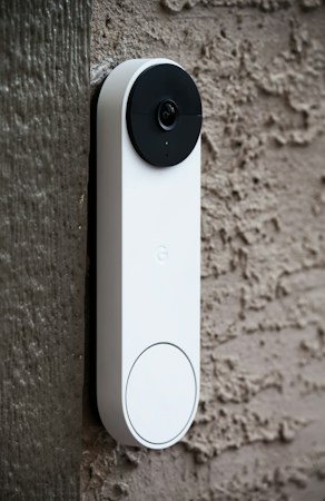 A security camera mounted on the side of a wall, similar to the doorbell and porch cameras many Centennial Hills homeowners use