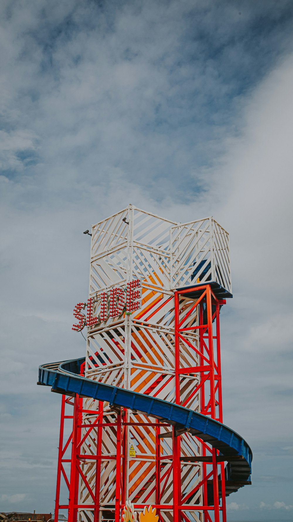 a tall tower with a slide in the middle of it