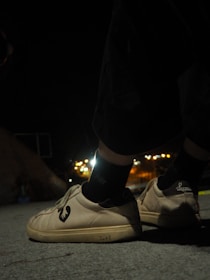 Nike running shoes showcased on a city street background during golden hour.