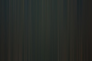 Bright green and blue gradient lines forming a tech-inspired geometric pattern