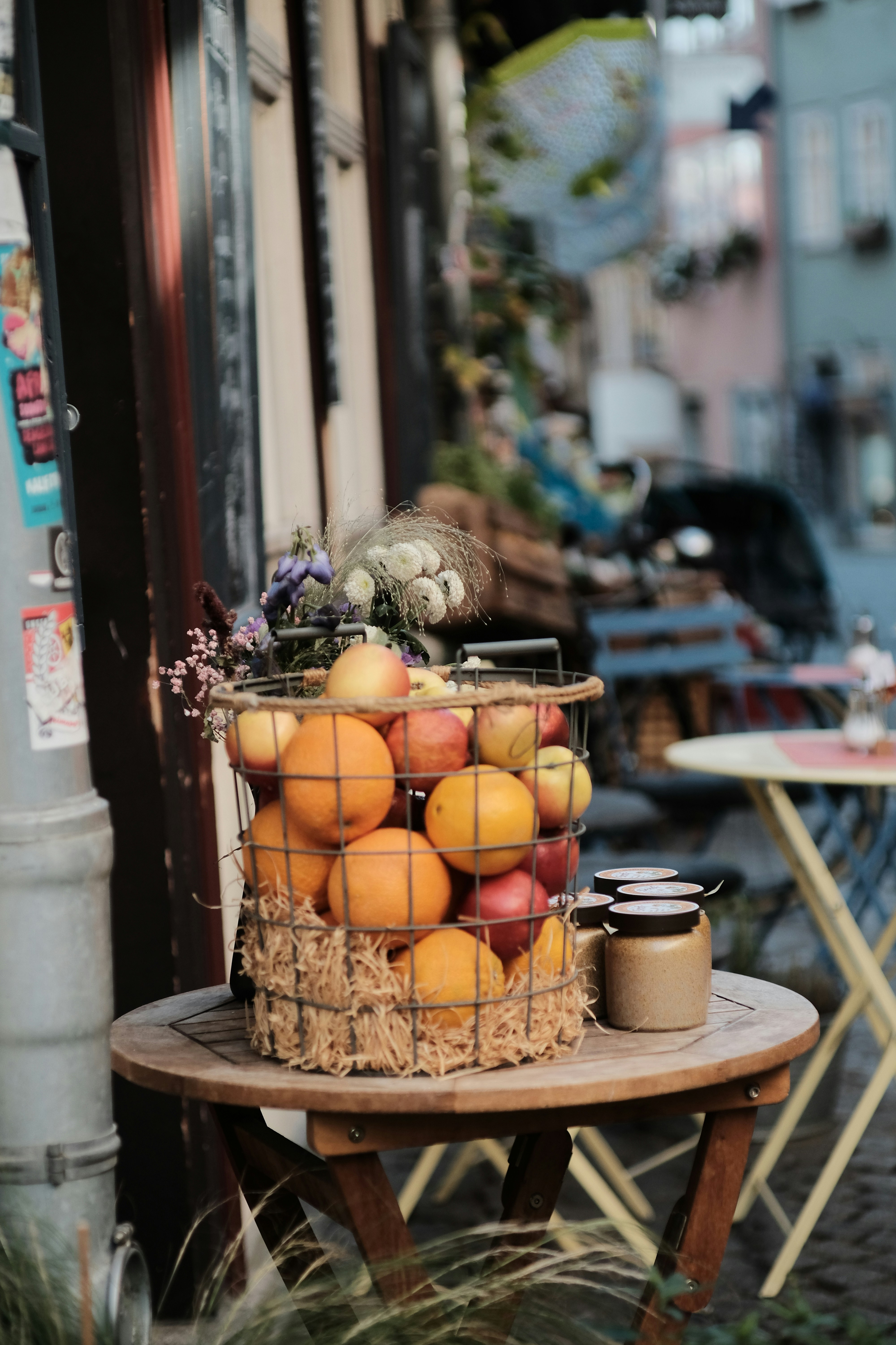 a basket of fruit sitting on top of a wooden table