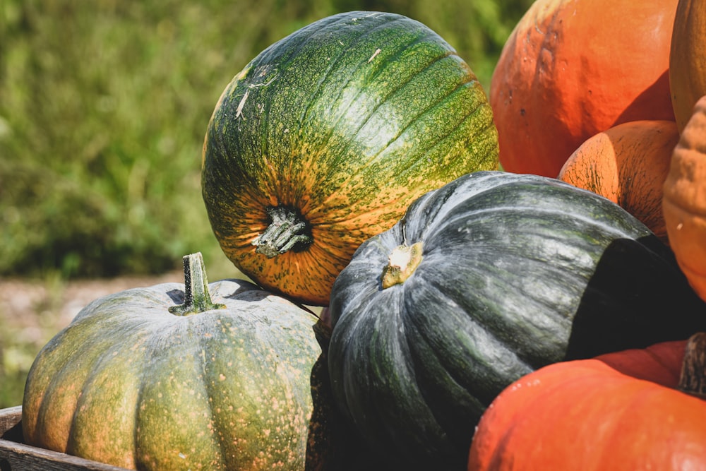 a pile of pumpkins sitting on top of each other