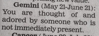 A close-up of a newspaper horoscope section, specifically the entry for Gemini from May 21 to June 21. It predicts that someone who is not present thinks of and adores the reader.