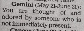A close-up of a newspaper horoscope section, specifically the entry for Gemini from May 21 to June 21. It predicts that someone who is not present thinks of and adores the reader.