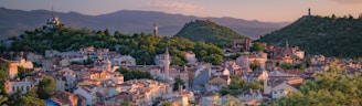 a small town surrounded by trees and mountains