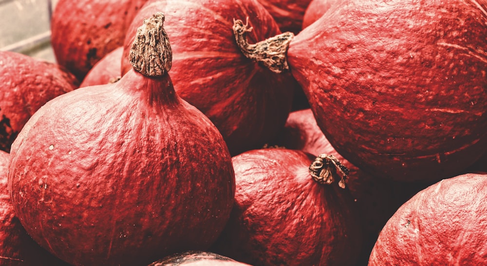 a pile of red onions sitting next to each other